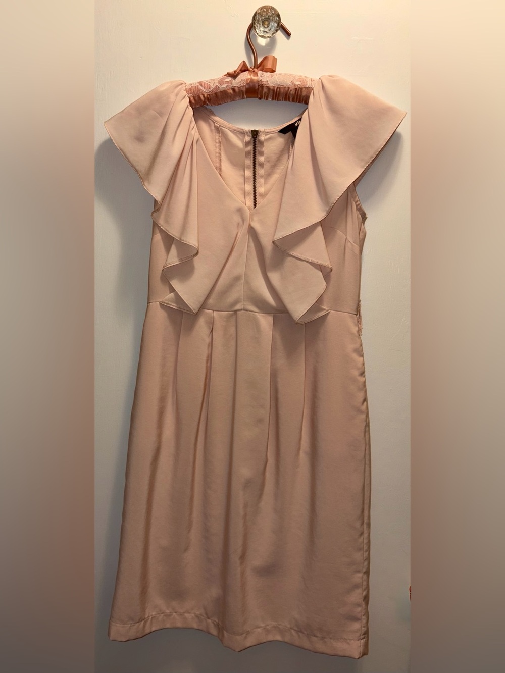 H&M light pink dress with V-neckline,  fluttery ruffle details, zippered back